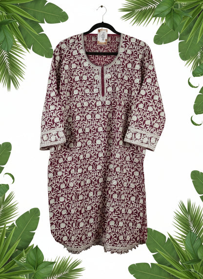 Red and white patterned shirt on a white surface