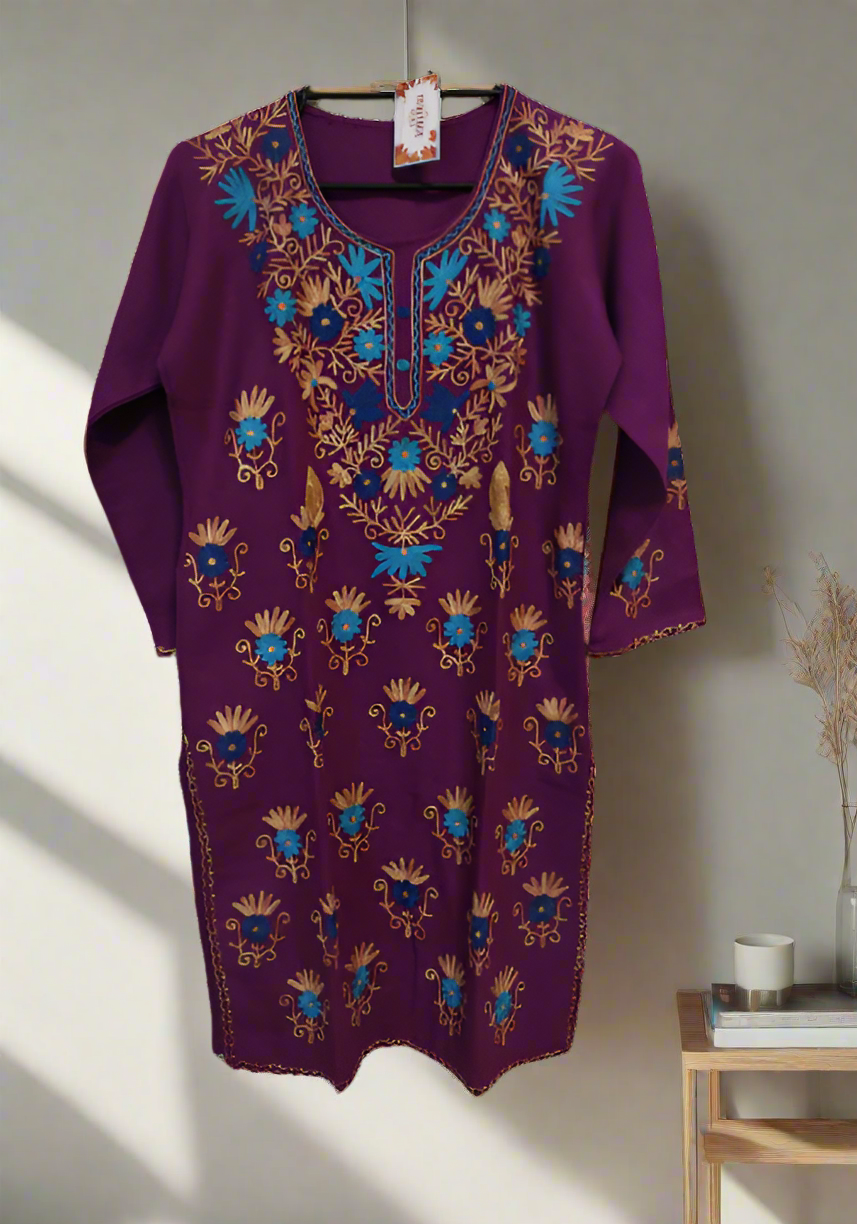 Purple dress with blue and gold floral embroidery on a white background